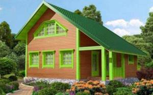Дом из бруса с зеленой отделкой